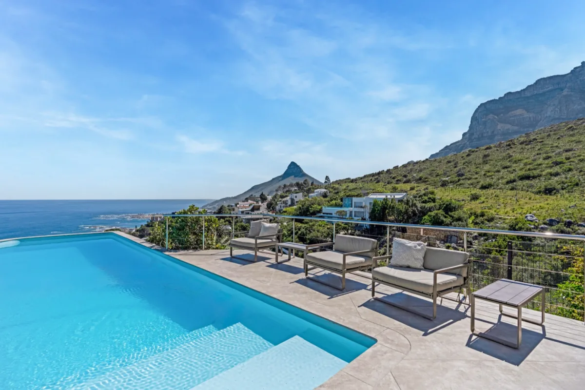 Pool terrace overlooking the Atlantic with the mountain rising beside Camps Bay